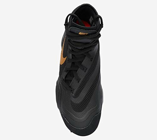 Black Nike high-top sneaker with gold swoosh.